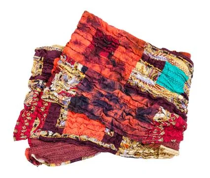 Folded stitched red brown patchwork scarf isolated 写真素材
