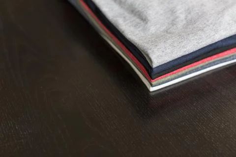 Folded-tees-on-table   Stock Photos