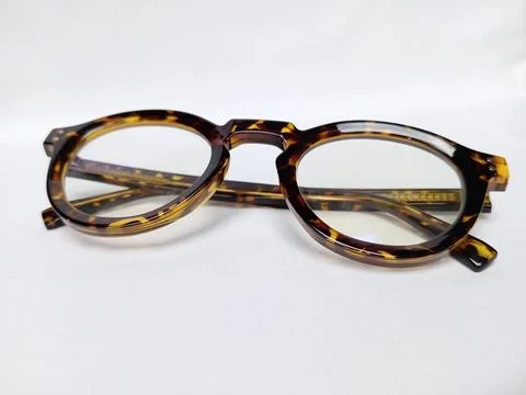 Folded tiger pattern eyeglass on white background. Stock Photos