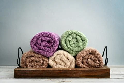 Folded towels with ranunculus 스톡 사진