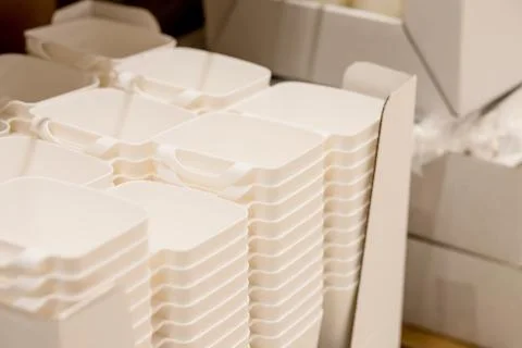 Folded white transparent plastic container.stack of plastic containers, boxes Foto stock