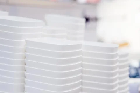 Folded white transparent plastic container.stack of plastic containers, boxes Foto stock