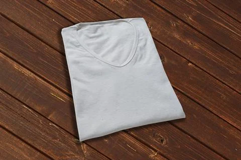 Folded white v neck t-shirt with wood background Stock Illustration