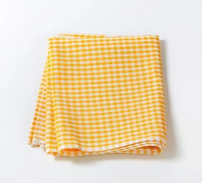 Folded yellow and white checkered cloth Stock Photos