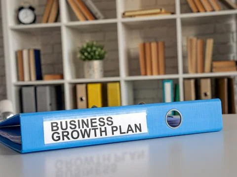 Folder with business growth plan on the table. Stock Photos