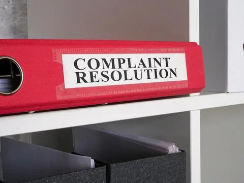 Folder with complaint resolution papers. Stock Photos