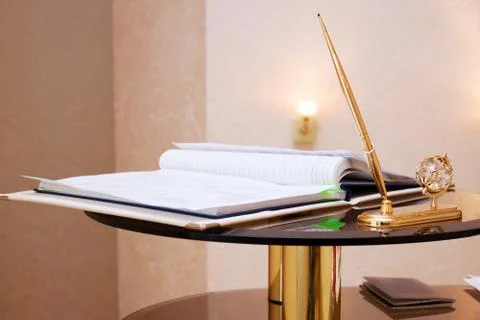 Folder with documents on signing marriage certificate, writing materials clos Stock Photos