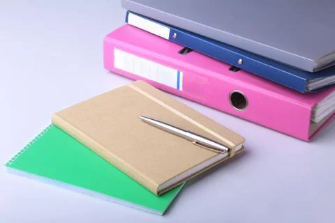 Folder file, note and pen on the desk. blurred background. Stock Photos