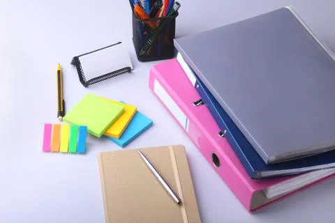 Folder file, note and pen on the desk. blurred background. Stock Photos
