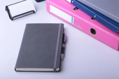 Folder file, note and pen on the desk. blurred background. Stock Photos