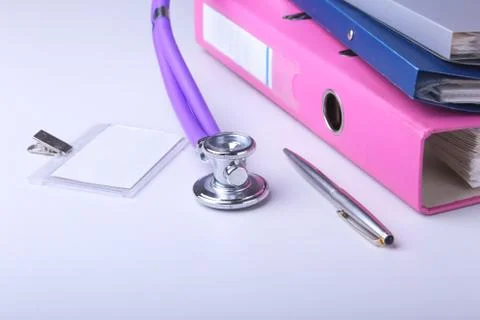 Folder file, stethoscope and RX prescription on the desk. blurred background. Stock Photos