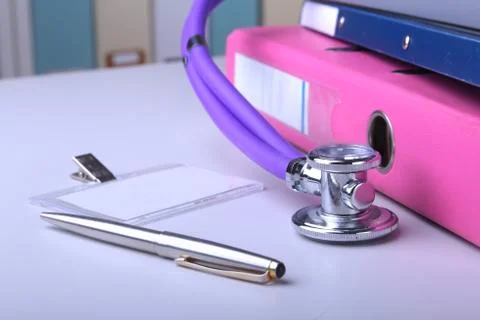 Folder file, stethoscope and RX prescription on the desk. blurred background. Stock Photos