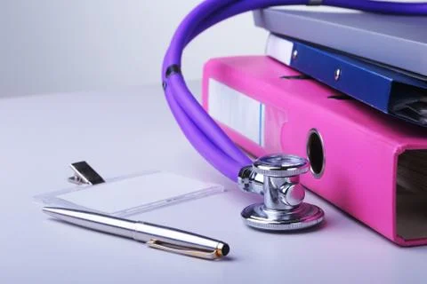 Folder file, stethoscope and RX prescription on the desk. blurred background. Stock Photos