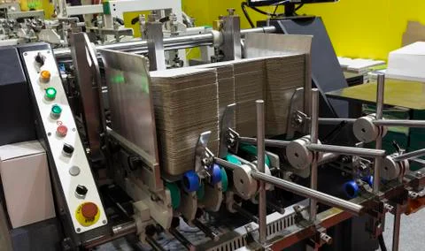 A folder gluer machine for carton box Stock Photos