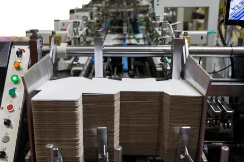 Folder gluer machine for carton box Stock Photos