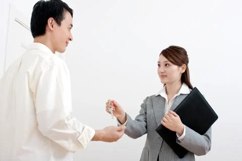 Folder Oriental Two people. Real Estate cooperation Luxx Keys Adult Women Stock Photos