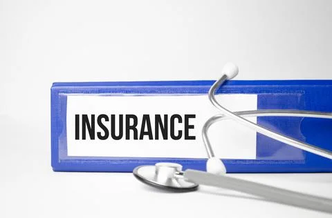 Folder with paper text iNSURANCE , on a table with a stethoscope and medical  Stock Photos