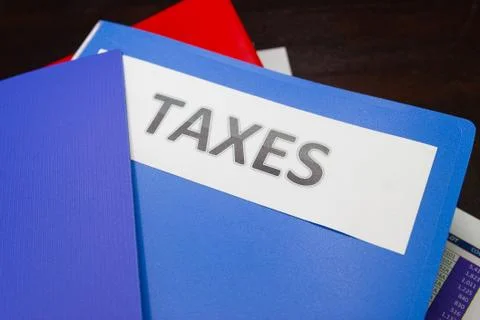 Folder Tax documents and paper files on table concept Annual tax payment Stock Photos