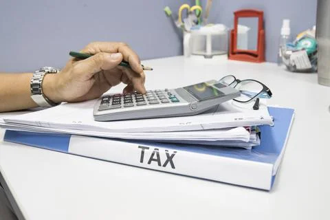 Folder Tax documents and paper files with calculator 스톡 사진
