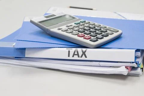 Folder Tax documents and paper files with calculator 스톡 사진