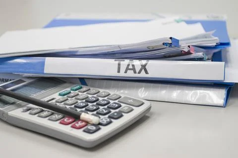 Folder Tax documents and paper files with calculator Photos