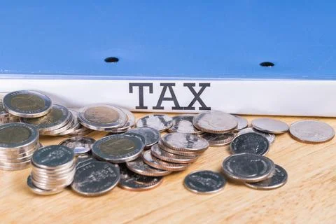 Folder Tax documents and stack of coin, concept Annual tax payment at work .. Fotos Stock