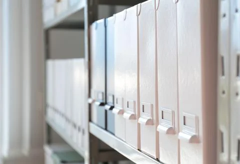 Folders with documents on shelf in archive Stockfoto's