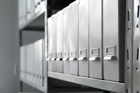 Folders with documents on shelf in archive Stockfoto's