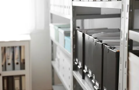 Folders with documents on shelf in archive. Space for text Stockfoto's