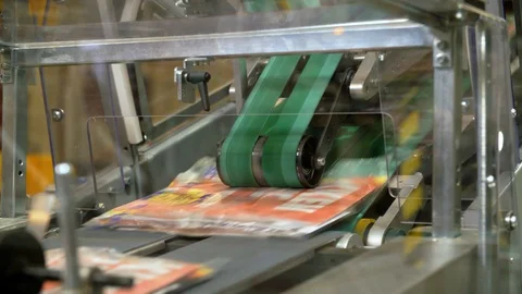 Folders Going Through A Sorting Machine Stock Footage 129398970