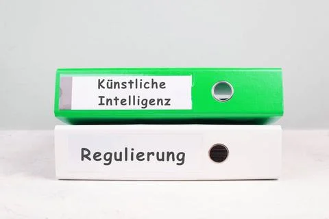Folders with the words artificial intelligence and regulation, german lang... Stock Photos