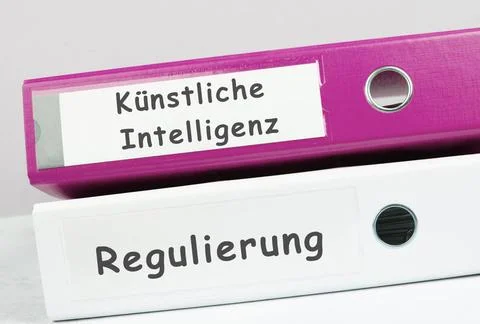 Folders with the words artificial intelligence and regulation, german lang... Stock Photos