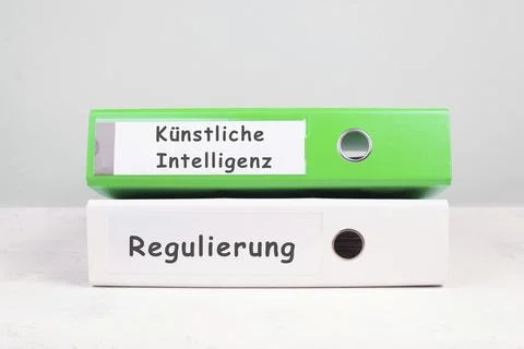 Folders with the words artificial intelligence and regulation, german language, Stock Photos