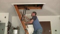 Closing attic ladder door with a stick, Stock Video