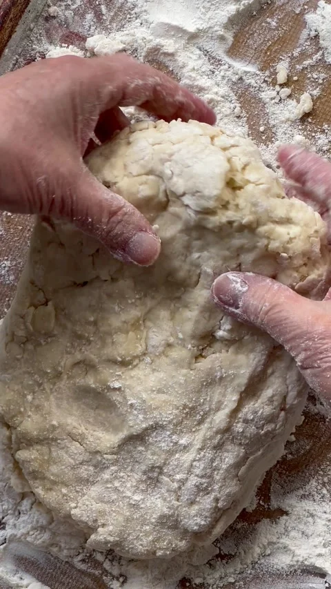 Folding biscuit dough vertical Stock Footage 235631728