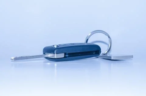 Folding car key with remote control blue toned Stock Photos