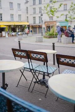 Folding Chairs on a Small Round Table Standing Outside of a Restaurant on t.. Stock Photos
