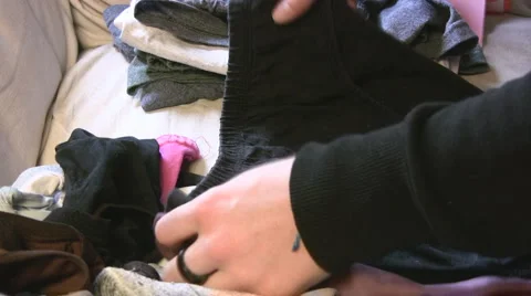 Folding clothing Stock-Footage 4280645