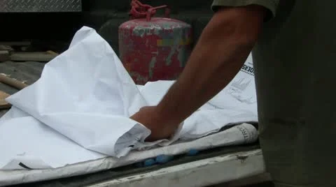 Folding up Construction Plans Stockbeeldmateriaal 12580730