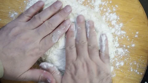 Folding dough overhead Stock Footage 121120047