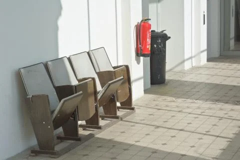Folding down theater seating with trashcan Stock Photos