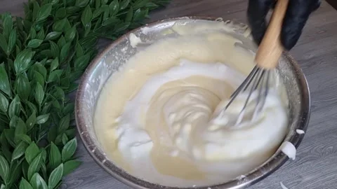 Folding Egg Whites into Cake Batter | Mixing Whipped Cream Stock Footage 345392070