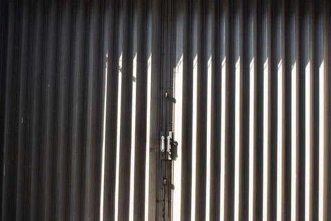 Folding gate patter background with shadow. Stock Photos