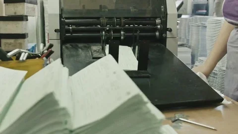 Folding machine folds printed offset sheet, polygraph industry Stock Footage 69126058