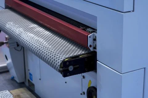 Folding machine industrial. Demonstration of the workflow. Equipment for colo Stock Photos