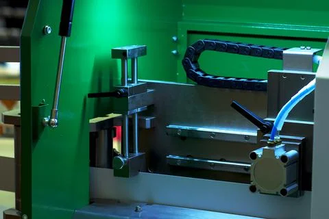 Folding machine industrial. Demonstration of the workflow. Equipment for colo Stock Photos