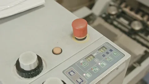 Folding machine on printing polygraph industry - red button and conveyer Stock Footage 69126414