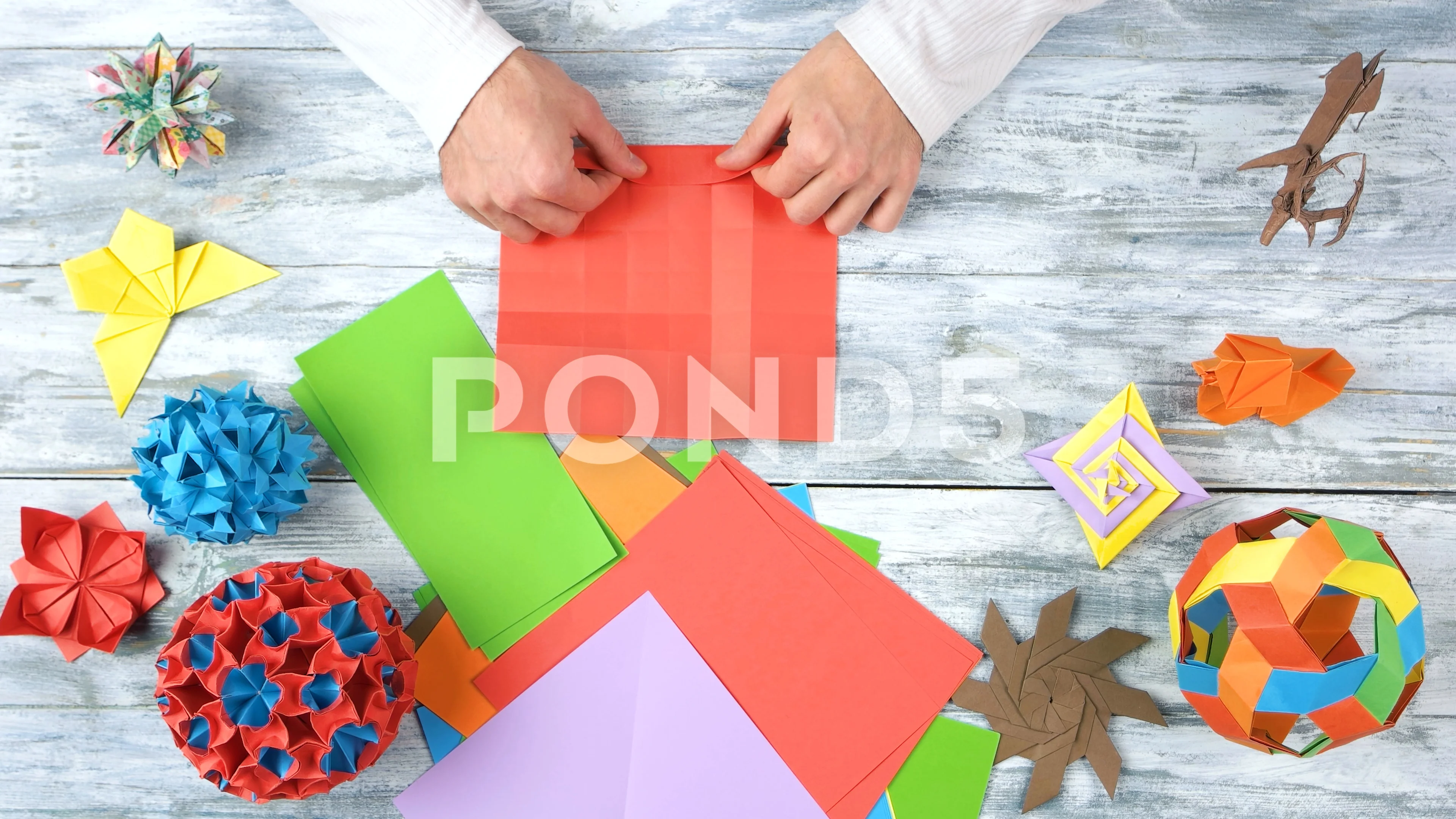 Folding red origami paper., Stock Video