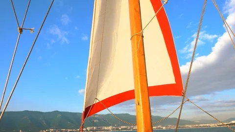 Folding the sail on yacht. Stock Footage 90403492