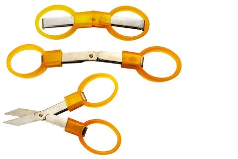 Folding scissors on a white background Stock Photos